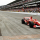 Michael Schumacher takes the checkered flag at the controversial 2005 U.S. Grand Prix.